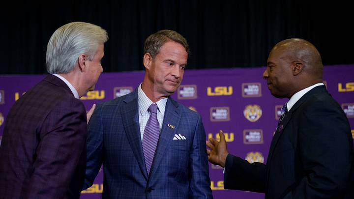 Dec 1, 2025; Baton Rouge, LA, USA; LSU president Wade Rousse, left, LSU new head coach Lane Kiffin, and LSU athletic director Verge Ausberry greet each other at South Stadium Club at Tiger Stadium. Mandatory Credit: Matthew Hinton-Imagn Images Dec 1, 2025; Baton Rouge, LA, USA; LSU president Wade Rousse, left, LSU new head coach Lane Kiffin, and LSU athletic director Verge Ausberry greet each other at South Stadium Club at Tiger Stadium. Mandatory Credit: Matthew Hinton-Imagn Images