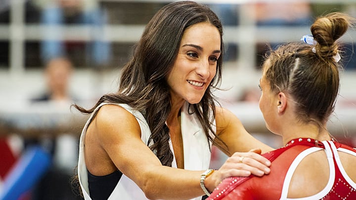 Arkansas gymnastics coach Jordyn Wieber assures one of her gymnasts that all will be fine.
