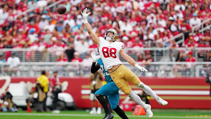 Sep 28, 2025; Santa Clara, California, USA; San Francisco 49ers tight end Jake Tonges (88) jumps to make a catch during the second half against the Jacksonville Jaguars at Levi's Stadium. Mandatory Credit: Darren Yamashita-Imagn Images