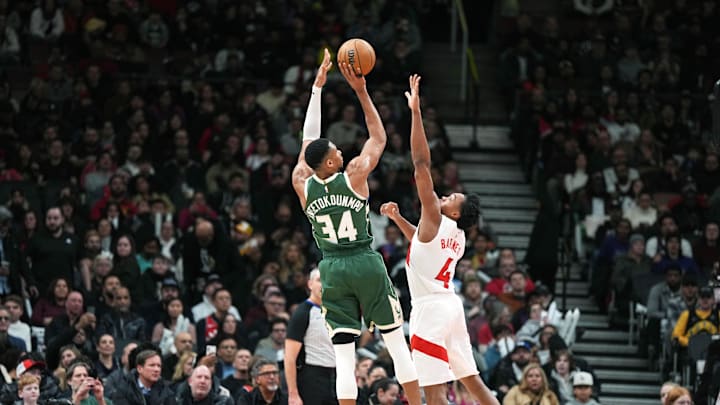 Jan 6, 2025; Toronto, Ontario, CAN; Milwaukee Bucks forward Giannis Antetokounmpo (34) shoots the ball as Toronto Raptors forward Scottie Barnes (4) defends during the third quarter at Scotiabank Arena. Mandatory Credit: Nick Turchiaro-Imagn Images Jan 6, 2025; Toronto, Ontario, CAN; Milwaukee Bucks forward Giannis Antetokounmpo (34) shoots the ball as Toronto Raptors forward Scottie Barnes (4) defends during the third quarter at Scotiabank Arena. Mandatory Credit: Nick Turchiaro-Imagn Images