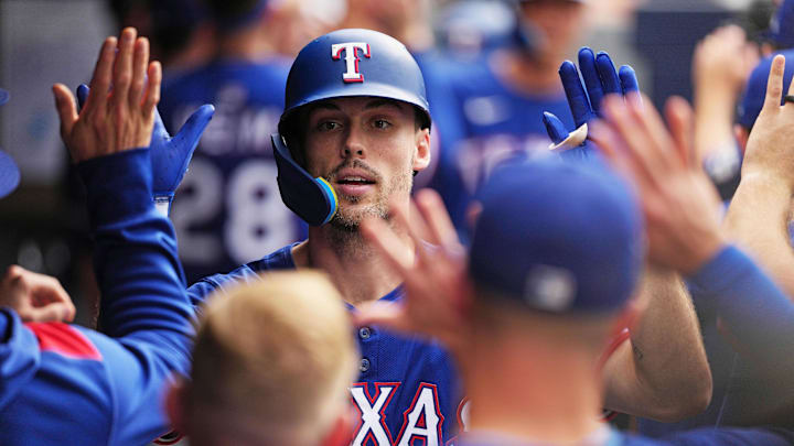 Texas Rangers center fielder Evan Carter celebrates.