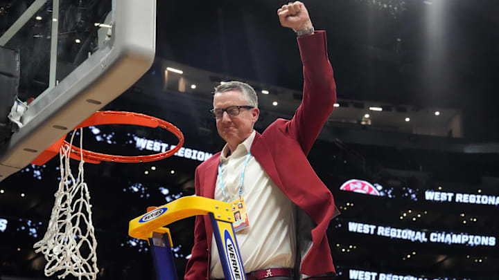 Mar 30, 2024; Los Angeles, CA, USA;  Alabama Crimson Tide athletic director Greg Byrne cuts down the