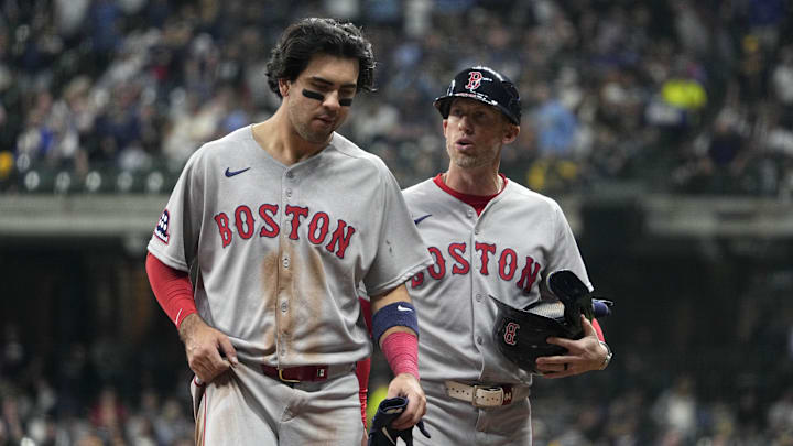 May 27, 2025; Milwaukee, Wisconsin, USA; Boston Red Sox third base coach/outfield instructor Kyle Hudson (84) talks with Boston Red Sox shortstop Marcelo Mayer (39) after the top of the seventh inning against the Milwaukee Brewers  at American Family Field. Mandatory Credit: Michael McLoone-Imagn Images