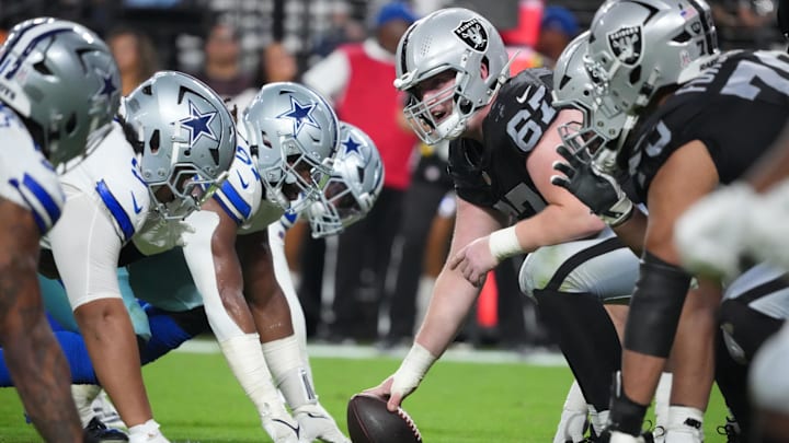 Nov 17, 2025; Paradise, Nevada, USA; A general view of the line of scrimmage as Las Vegas Raiders center Will Putnam (67) prepares to snap the ball against the Dallas Cowboys during the second half at Allegiant Stadium. Mandatory Credit: Kirby Lee-Imagn Images