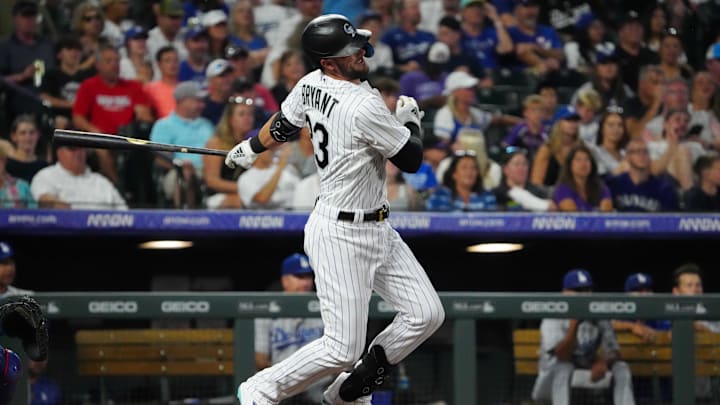 Jul 30, 2022; Denver, Colorado, USA; Colorado Rockies left fielder Kris Bryant (23) singles in the