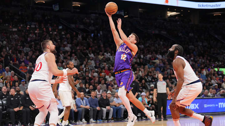 Mar 4, 2025; Phoenix, Arizona, USA; Phoenix Suns guard Collin Gillespie (12) shoots against the LA Clippers during the second half at PHX Center. Mandatory Credit: Joe Camporeale-Imagn Images