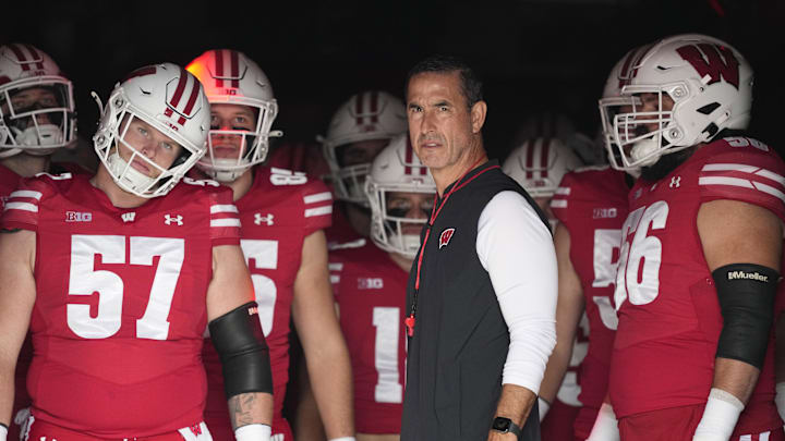 Oct 18, 2025; Madison, Wisconsin, USA;  Wisconsin Badgers head coach Luke Fickell during warmups prior to the game against the Ohio State Buckeyes at Camp Randall Stadium. Mandatory Credit: Jeff Hanisch-Imagn Images