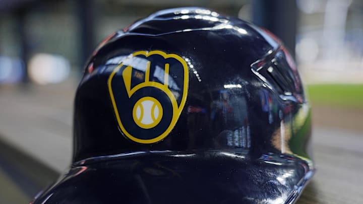 Jun 10, 2024; Milwaukee, Wisconsin, USA; A Milwaukee Brewers batting helmet sits on the bench during batting practice prior to the game against the Toronto Blue Jays at American Family Field. Mandatory Credit: Jeff Hanisch-Imagn Images Jun 10, 2024; Milwaukee, Wisconsin, USA; A Milwaukee Brewers batting helmet sits on the bench during batting practice prior to the game against the Toronto Blue Jays at American Family Field. Mandatory Credit: Jeff Hanisch-Imagn Images