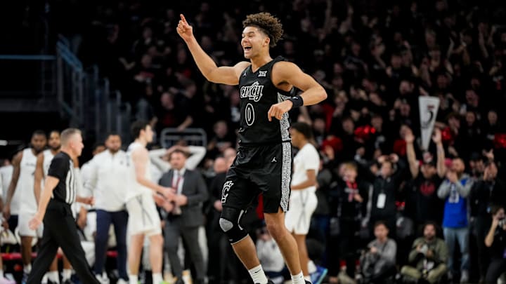 Cincinnati Bearcats guard Dan Skillings Jr. (0) celebrates as time expires in the second half of the 92nd Annual Crosstown Shootout NCAA basketball game between the Cincinnati Bearcats and the Xavier Musketeers at Fifth Third Arena on the UC campus in Cincinnati on Saturday, Dec. 14, 2024. The Bearcats won 68-65. Cincinnati Bearcats guard Dan Skillings Jr. (0) celebrates as time expires in the second half of the 92nd Annual Crosstown Shootout NCAA basketball game between the Cincinnati Bearcats and the Xavier Musketeers at Fifth Third Arena on the UC campus in Cincinnati on Saturday, Dec. 14, 2024. The Bearcats won 68-65.