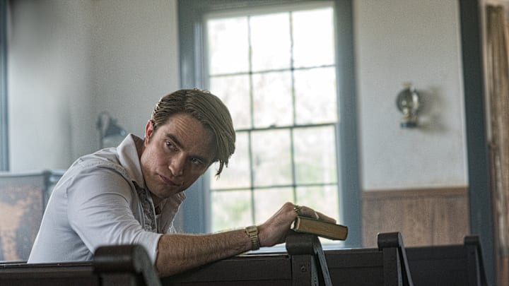 The Devil All The Time: Robert Pattinson as Preston Teagardin. Photo Cr. Glen Wilson/Netflix © 2020 The Devil All The Time: Robert Pattinson as Preston Teagardin. Photo Cr. Glen Wilson/Netflix © 2020