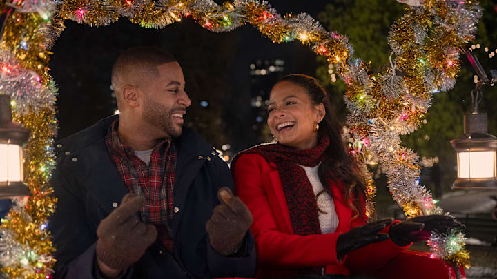 Meet Me Next Christmas. (L to R) Devale Ellis as Teddy and Christina Milian as Layla in Meet Me Next Christmas. Cr. Sophie Giraud/Netflix © 2024.