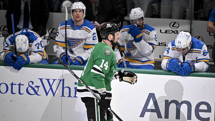 Feb 4, 2026; Dallas, Texas, USA; Dallas Stars left wing Jamie Benn (14) skates past the St. Louis Blues team bench after he scores the game winning goal during the third period at the American Airlines Center. Mandatory Credit: Jerome Miron-Imagn Images