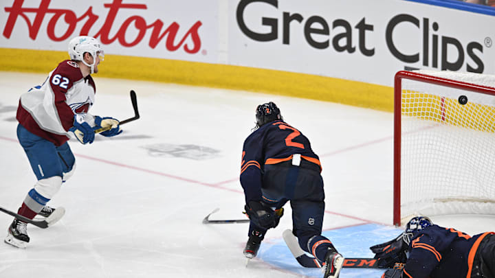 Jun 6, 2022; Edmonton, Alberta, CAN;  Colorado Avalanche forward Artturi Lehkonen (62) scores against Edmonton Oilers goaltender Mike Smith (41) and defenseman Duncan Keith (2) during overtime in game four of the Western Conference Final of the 2022 Stanley Cup Playoffs at Rogers Place. Mandatory Credit: Walter Tychnowicz-Imagn Images