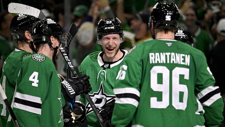 May 21, 2025; Dallas, Texas, USA; Dallas Stars defenseman Miro Heiskanen (4) and defenseman Esa Lindell (23) and right wing Mikko Rantanen (96) celebrate the empty net goal scored by Lindell against the Edmonton Oilers during the third period in game one of the Western Conference Final of the 2025 Stanley Cup Playoffs at American Airlines Center. Mandatory Credit: Jerome Miron-Imagn Images