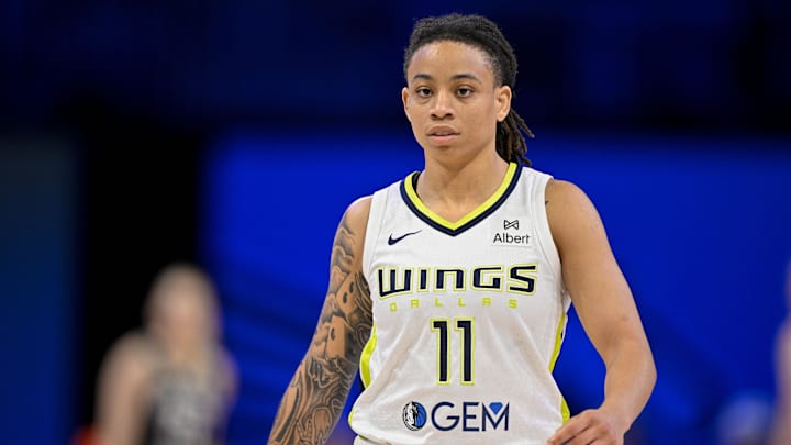Jul 28, 2025; Arlington, Texas, USA; Dallas Wings guard JJ Quinerly (11) in action during the game between the Dallas Wings and the New York Liberty at College Park Center. Mandatory Credit: Jerome Miron-Imagn Images