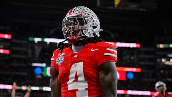 Dec 31, 2025; Arlington, TX, USA; Ohio State Buckeyes wide receiver Jeremiah Smith (4) celebrates after he runs for a touchdown during the 2025 Cotton Bowl and quarterfinal game of the College Football Playoff at AT&T Stadium. Mandatory Credit: Jerome Miron-Imagn Images