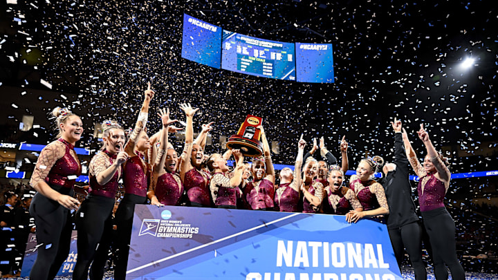 Apr 15, 2023; Fort Worth, TX, USA; The University of Oklahoma Sooners celebrate with the trophy as the 2023 NCAA Women's Gymnastics national champions for the second year in a row.