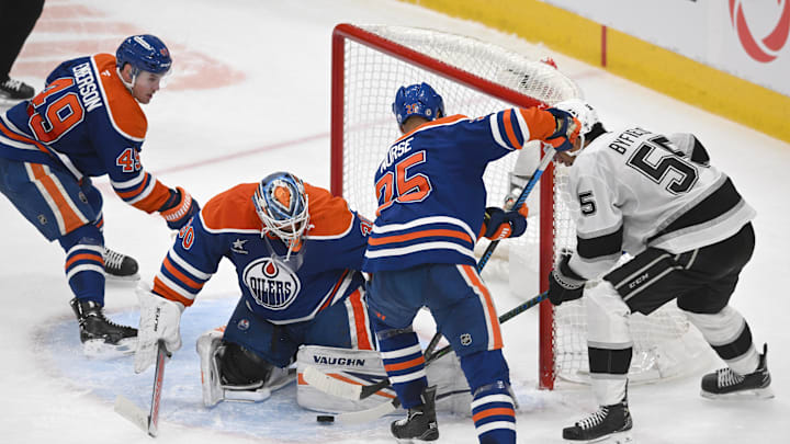 Edmonton Oilers goalie Calvin Pickard (30) looks for the puck with defenseman Darnell Nurse (25) against Los Angeles Kings right wing Quinton Byfield (5)