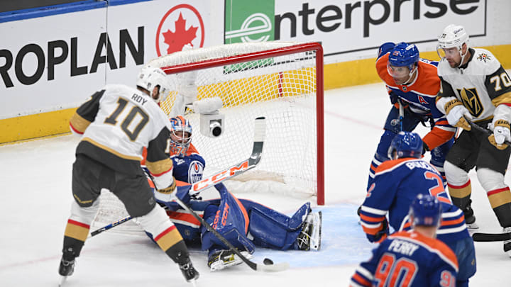 Las Vegas Golden Knights centre Nicolas Roy (10) tries to get the puck past Edmonton Oilers goalie Stuart Skinner (74) 