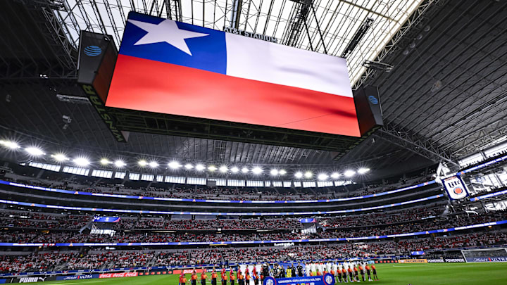 Jun 21, 2024; Arlington, TX, USA; A view of the field and the fans and the teams and the flag during the playing of the national anthem of Chile before the game between Chile and Peru in a 2024 Copa America match at AT&T Stadium. Mandatory Credit: Jerome Miron-Imagn Images