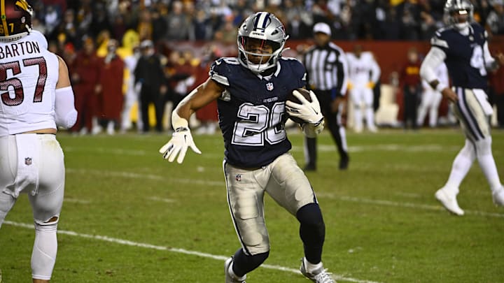 Jan 7, 2024; Landover, Maryland, USA; Dallas Cowboys running back Tony Pollard (20) carries the ball