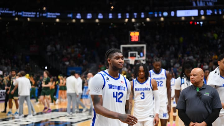 Mar 21, 2025; Seattle, WA, USA; Memphis Tigers forward Dain Dainja (42) walks off the court after losing to Colorado State Rams at Climate Pledge Arena. Mandatory Credit: Steven Bisig-Imagn Images
