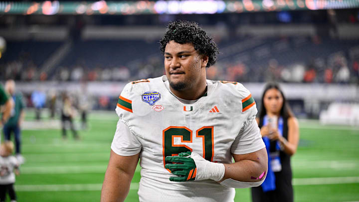 Dec 31, 2025; Arlington, TX, USA; Miami Hurricanes offensive lineman Francis Mauigoa (61) walks off the field after the 2025 Cotton Bowl and quarterfinal game of the College Football Playoff at AT&T Stadium. Mandatory Credit: Jerome Miron-Imagn Images
