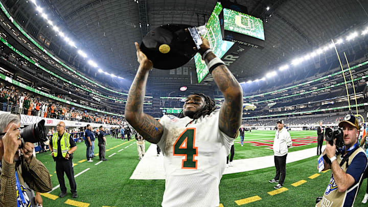 Dec 31, 2025; Arlington, TX, USA; Miami Hurricanes running back Mark Fletcher Jr. (4) celebrates defeating the Ohio State Buckeyes during the 2025 Cotton Bowl and quarterfinal game of the College Football Playoff at AT&T Stadium. Mandatory Credit: Jerome Miron-Imagn Images