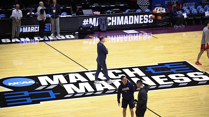Mar 19, 2026; San Diego, CA, USA; Arizona Wildcats head coach Tommy Lloyd, center, looks on during a practice session ahead of the first round of the men's 2026 NCAA Tournament at Viejas Arena. Mandatory Credit: Denis Poroy-Imagn Images