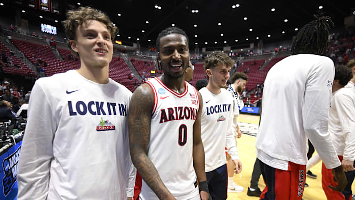Mar 22, 2026; San Diego, CA, USA; Arizona Wildcats guard Jaden Bradley (0) celebrates after defeating the Utah State Aggies during a second round game of the men's 2026 NCAA Tournament at Viejas Arena. Mandatory Credit: Denis Poroy-Imagn Images