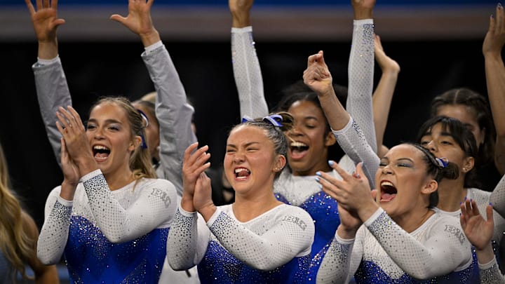  The UCLA Bruins gymnasts celebrate during the 2025 Women's National Gymnastics Semifinal. 