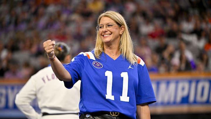 Apr 16, 2026; Fort Worth, TX, USA; University of Florida head coach Jenny Rowland wears a Steve Spurrier jersey during semifinals for the 2026 NCAA Women’s Gymnastics National Championships at Dickies Arena. Mandatory Credit: Jerome Miron-Imagn Images