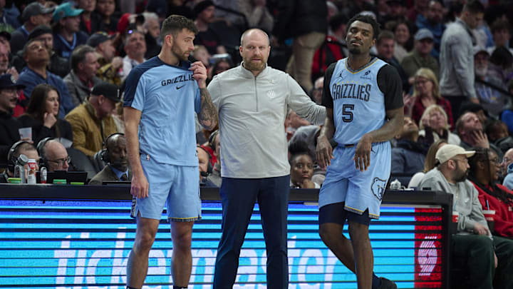 Mar 19, 2025; Portland, Oregon, USA; Memphis Grizzlies head coach Taylor Jenkins talks to guard John Konchar (46), left, and guard Vince Williams Jr. (5) during the second half against the Portland Trail Blazers at Moda Center. Mandatory Credit: Troy Wayrynen-Imagn Images