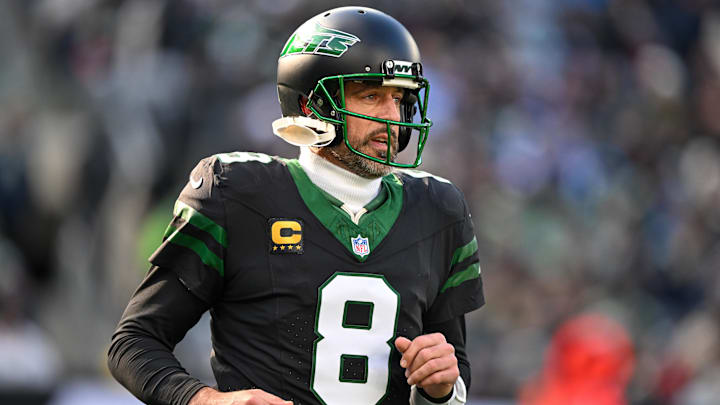 Dec 1, 2024; East Rutherford, New Jersey, USA; New York Jets quarterback Aaron Rodgers (8) during the first quarter against the Seattle Seahawks at MetLife Stadium. Mandatory Credit: Mark Smith-Imagn Images