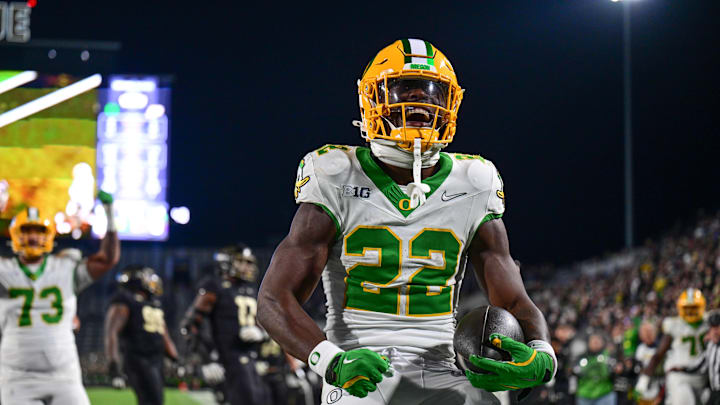 Oct 18, 2024; West Lafayette, Indiana, USA; Oregon Ducks running back Jay Harris (22) celebrates scoring a touchdown during the second half against the Purdue Boilermakers at Ross-Ade Stadium. Mandatory Credit: Marc Lebryk-Imagn Images