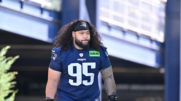 Jul 23, 2025; Foxborough, MA, USA; New England Patriots defensive tackle Khyiris Tonga (95) walks to the practice field for training camp at Gillette Stadium. Mandatory Credit: Eric Canha-Imagn Images Jul 23, 2025; Foxborough, MA, USA; New England Patriots defensive tackle Khyiris Tonga (95) walks to the practice field for training camp at Gillette Stadium. Mandatory Credit: Eric Canha-Imagn Images