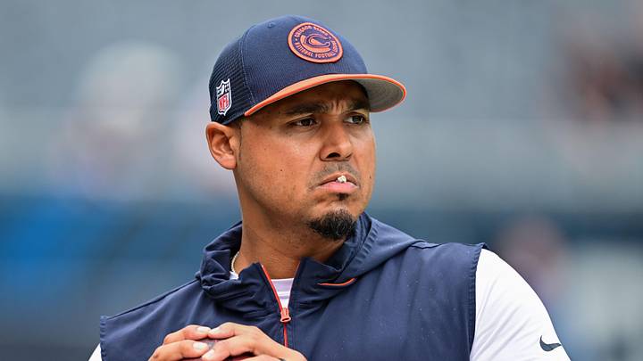 Aug 17, 2024; Chicago, Illinois, USA; Chicago Bears general manager Ryan Poles plays catch on the sideline before the game against the Cincinnati Bengals at Soldier Field. Mandatory Credit: Daniel Bartel-Imagn Images