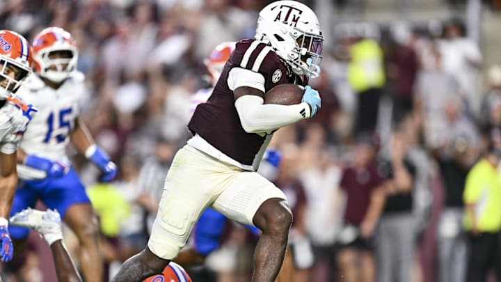 Oct 11, 2025; College Station, Texas, USA; Texas A&M Aggies running back Le'Veon Moss (8) runs the ball in for a touchdown during the second quarter against the Florida Gators at Kyle Field. Mandatory Credit: Maria Lysaker-Imagn Images 