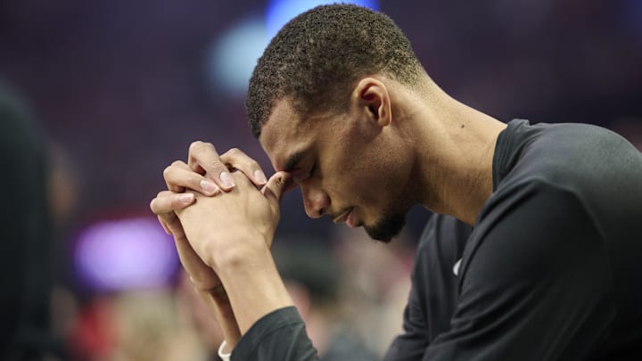 Apr 26, 2026; Portland, Oregon, USA; San Antonio Spurs forward Victor Wembanyama (1) sits on the bench before a game against the Portland Trail Blazers during game four of the first round of the 2026 NBA Playoffs at Moda Center. Mandatory Credit: Troy Wayrynen-Imagn Images