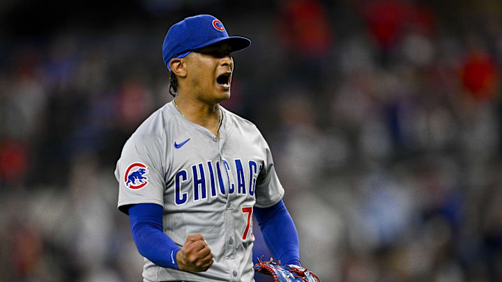Mar 31, 2024; Arlington, Texas, USA; Chicago Cubs relief pitcher Adbert Alzolay (73) celebrates after the Cubs defeat the Texas Rangers at Globe Life Field. Mandatory Credit: Jerome Miron-Imagn Images