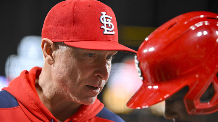 Apr 1, 2025; St. Louis, Missouri, USA;  St. Louis Cardinals hitting coach Brant Brown (73) talks with right fielder Jordan Walker (18) before an at bat against the Los Angeles Angels during the tenth inning at Busch Stadium. Mandatory Credit: Jeff Curry-Imagn Images