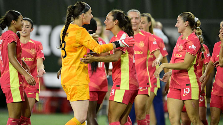 Jul 5, 2024; Portland, Oregon, USA; Portland Thorns FC goalkeeper Shelby Hogan (18) and forward Izzy D'Aquila (24) celebrate with teammates after a game against the San Diego Wave FC at Providence Park. Mandatory Credit: Troy Wayrynen-USA TODAY Sports