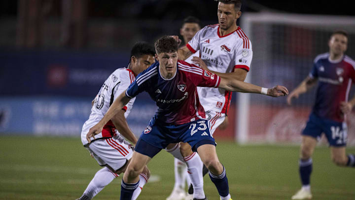 San Jose Earthquakes midfielder Michael Baldisimo (55), midfielder Alfredo Morales (6) and FC Dallas forward Logan Farrington (23)  