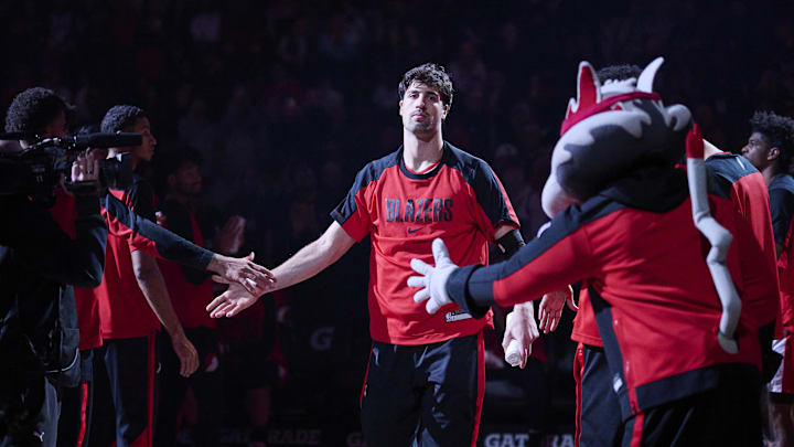 Mar 19, 2025; Portland, Oregon, USA; Portland Trail Blazers forward Deni Avdija (8) high fives teammates during introductions before a game against the Memphis Grizzlies at Moda Center. Mandatory Credit: Troy Wayrynen-Imagn Images
