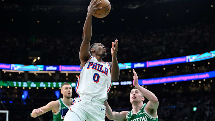 Dec 25, 2024; Boston, Massachusetts, USA; Philadelphia 76ers guard Tyrese Maxey (0) shoots a layup against the Boston Celtics during the first half at TD Garden. Mandatory Credit: Eric Canha-Imagn Images