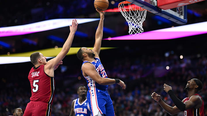 Feb 5, 2025; Philadelphia, Pennsylvania, USA; Philadelphia 76ers guard Eric Gordon (23) drives to shoot against Miami Heat forward Nikola Jovic (5) in the fourth quarter at Wells Fargo Center. Mandatory Credit: Kyle Ross-Imagn Images