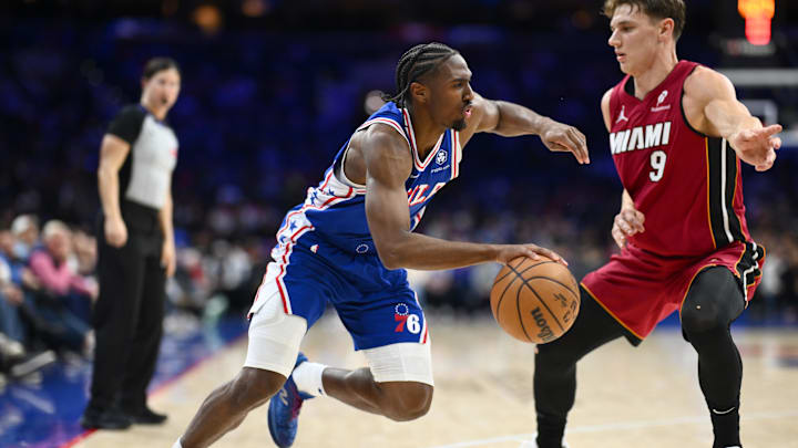 Feb 5, 2025; Philadelphia, Pennsylvania, USA; Philadelphia 76ers guard Tyrese Maxey (0) drives against Miami Heat guard Pelle Larsson (9) in the fourth quarter at Wells Fargo Center. Mandatory Credit: Kyle Ross-Imagn Images