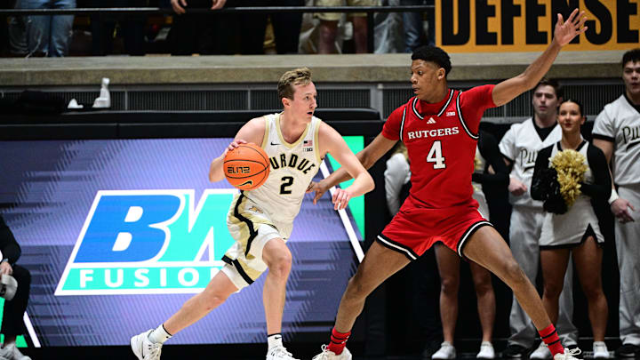 Mar 4, 2025; West Lafayette, Indiana, USA; Purdue Boilermakers guard Fletcher Loyer (2) drives toward the basket in front of Rutgers Scarlet Knights guard Ace Bailey (4) during the first half at Mackey Arena. Mandatory Credit: Marc Lebryk-Imagn Images