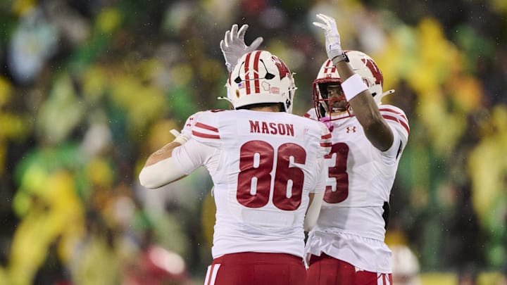 Oct 25, 2025; Eugene, Oregon, USA; Wisconsin Badgers tight end Lance Mason (86) celebrates with wide receiver Eugene Hilton Jr. (13) during the second half after scoring a touchdown against the Oregon Ducks at Autzen Stadium. Mandatory Credit: Troy Wayrynen-Imagn Images