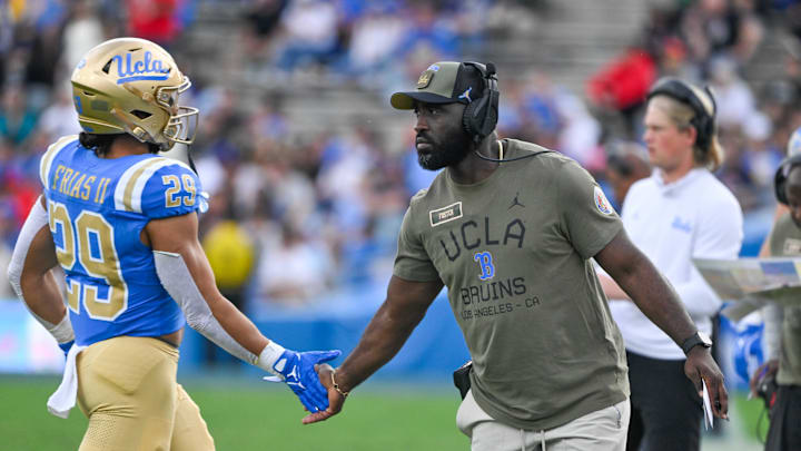 Nov 30, 2024; Pasadena, California, USA; UCLA Bruins head coach DeShaun Foster greets UCLA Bruins running back Anthony Frias II (29) as he returns to the bench during the third quarter against the Fresno State Bulldogs at Rose Bowl. Mandatory Credit: Robert Hanashiro-Imagn Images Nov 30, 2024; Pasadena, California, USA; UCLA Bruins head coach DeShaun Foster greets UCLA Bruins running back Anthony Frias II (29) as he returns to the bench during the third quarter against the Fresno State Bulldogs at Rose Bowl. Mandatory Credit: Robert Hanashiro-Imagn Images